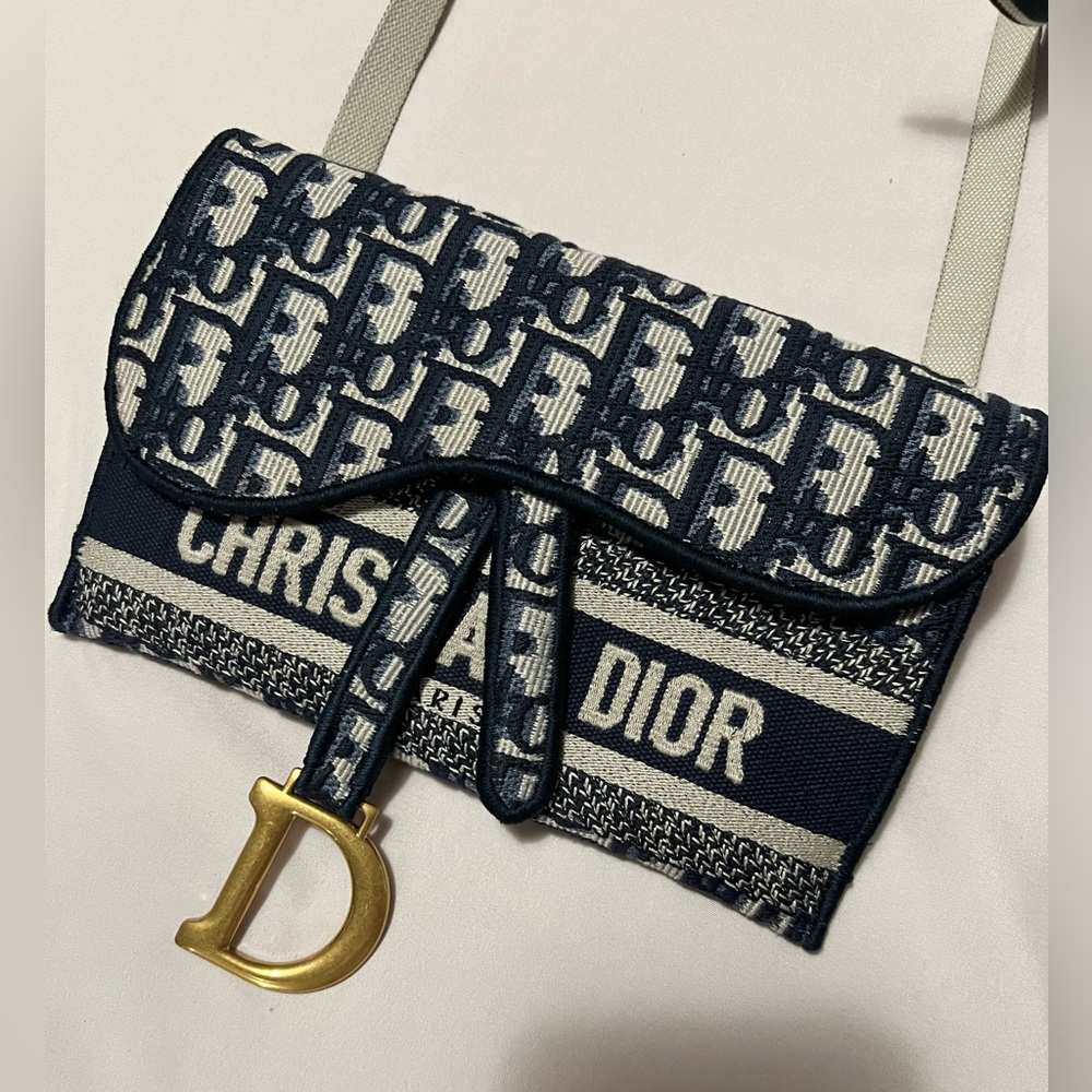 Dior Saddle Slim Pouch, can be used as a cross body or shoulder bag.